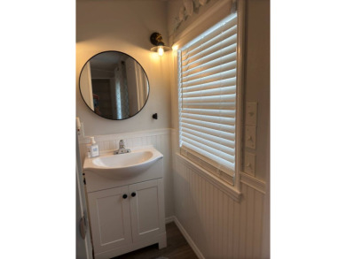 This great manufactured home on leased land is located in Lake on Pine Lakes Country Club in Florida - for sale on GolfHomes.com, golf home, golf lot