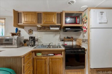 Back on the market, this charming 3 bedroom 1 bath 1999 camper on River Ridge Golf Club in Virginia - for sale on GolfHomes.com, golf home, golf lot