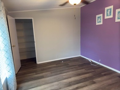 This great manufactured home on leased land is located in Lake on Pine Lakes Country Club in Florida - for sale on GolfHomes.com, golf home, golf lot