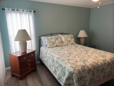 This great manufactured home on leased land is located in Lake on Pine Lakes Country Club in Florida - for sale on GolfHomes.com, golf home, golf lot