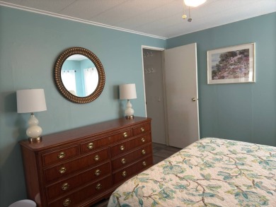 This great manufactured home on leased land is located in Lake on Pine Lakes Country Club in Florida - for sale on GolfHomes.com, golf home, golf lot