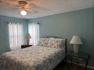 This great manufactured home on leased land is located in Lake on Pine Lakes Country Club in Florida - for sale on GolfHomes.com, golf home, golf lot