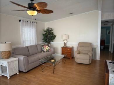 This great manufactured home on leased land is located in Lake on Pine Lakes Country Club in Florida - for sale on GolfHomes.com, golf home, golf lot