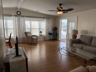 This great manufactured home on leased land is located in Lake on Pine Lakes Country Club in Florida - for sale on GolfHomes.com, golf home, golf lot