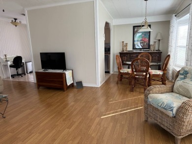 This great manufactured home on leased land is located in Lake on Pine Lakes Country Club in Florida - for sale on GolfHomes.com, golf home, golf lot