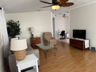 This great manufactured home on leased land is located in Lake on Pine Lakes Country Club in Florida - for sale on GolfHomes.com, golf home, golf lot