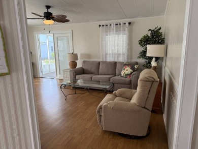 This great manufactured home on leased land is located in Lake on Pine Lakes Country Club in Florida - for sale on GolfHomes.com, golf home, golf lot