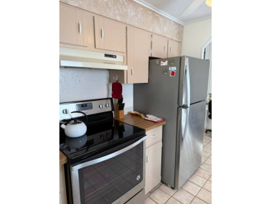 This great manufactured home on leased land is located in Lake on Pine Lakes Country Club in Florida - for sale on GolfHomes.com, golf home, golf lot