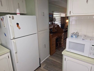 Move in ready! Complete with high end furnishings! Zebra blinds on Grasslands Golf and Country Club in Florida - for sale on GolfHomes.com, golf home, golf lot