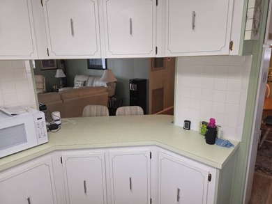 Move in ready! Complete with high end furnishings! Zebra blinds on Grasslands Golf and Country Club in Florida - for sale on GolfHomes.com, golf home, golf lot