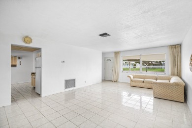 Welcome to this charming 2-bed, 2-bath single-family home on a on Leisureville Community Golf Course in Florida - for sale on GolfHomes.com, golf home, golf lot