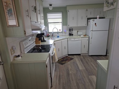 Move in ready! Complete with high end furnishings! Zebra blinds on Grasslands Golf and Country Club in Florida - for sale on GolfHomes.com, golf home, golf lot