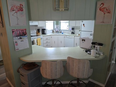 Move in ready! Complete with high end furnishings! Zebra blinds on Grasslands Golf and Country Club in Florida - for sale on GolfHomes.com, golf home, golf lot