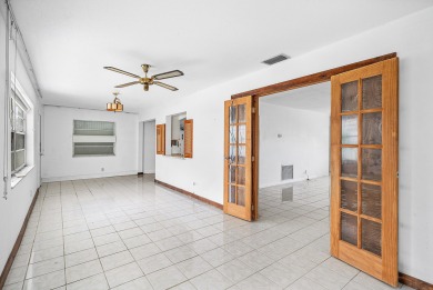 Welcome to this charming 2-bed, 2-bath single-family home on a on Leisureville Community Golf Course in Florida - for sale on GolfHomes.com, golf home, golf lot