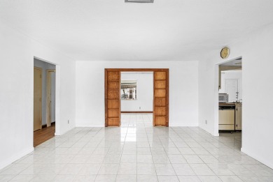 Welcome to this charming 2-bed, 2-bath single-family home on a on Leisureville Community Golf Course in Florida - for sale on GolfHomes.com, golf home, golf lot