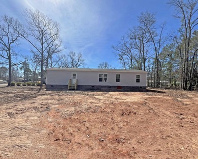 Live the lake life just steps away from Lake Marion! This BRAND on Players Course At Wyboo Plantation in South Carolina - for sale on GolfHomes.com, golf home, golf lot