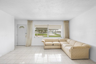 Welcome to this charming 2-bed, 2-bath single-family home on a on Leisureville Community Golf Course in Florida - for sale on GolfHomes.com, golf home, golf lot