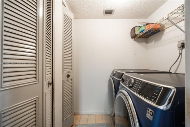 Step into this spacious and beautifully maintained 2-br, 2-ba on Palm-Aire Country Club and Resort - Palms in Florida - for sale on GolfHomes.com, golf home, golf lot