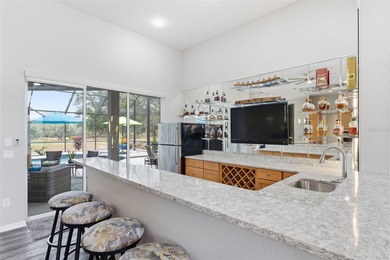 Experience elevated Florida living in this beautifully designed on Southern Woods Golf Club in Florida - for sale on GolfHomes.com, golf home, golf lot