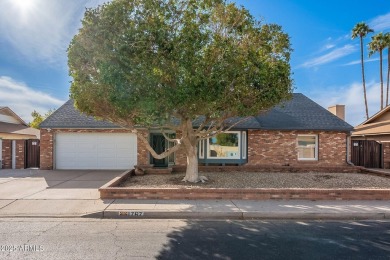 This charming Dobson Ranch home is freshly painted throughout on Dobson Ranch Municipal Golf Course in Arizona - for sale on GolfHomes.com, golf home, golf lot