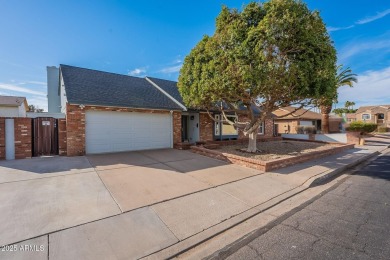 This charming Dobson Ranch home is freshly painted throughout on Dobson Ranch Municipal Golf Course in Arizona - for sale on GolfHomes.com, golf home, golf lot