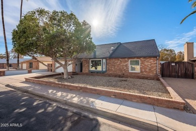 This charming Dobson Ranch home is freshly painted throughout on Dobson Ranch Municipal Golf Course in Arizona - for sale on GolfHomes.com, golf home, golf lot