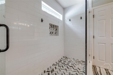 Enjoy resort-style living in this beautifully updated 4-bedroom on Lost Plantation Golf Club in Georgia - for sale on GolfHomes.com, golf home, golf lot