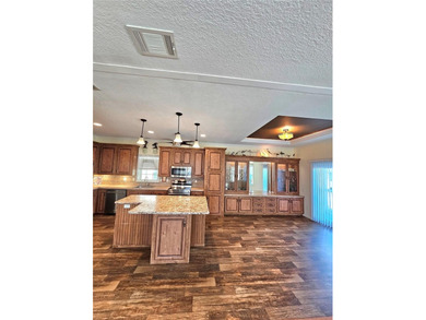 Welcome to a cheerful and inviting home tucked within the on Saint Andrews South Golf Club in Florida - for sale on GolfHomes.com, golf home, golf lot