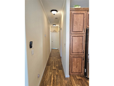 Welcome to a cheerful and inviting home tucked within the on Saint Andrews South Golf Club in Florida - for sale on GolfHomes.com, golf home, golf lot