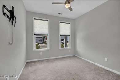 Discover the charm of low-maintenance living in this beautifully on Cape Fear National At Brunswick Forest in North Carolina - for sale on GolfHomes.com, golf home, golf lot