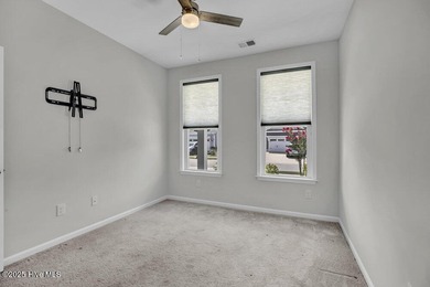 Discover the charm of low-maintenance living in this beautifully on Cape Fear National At Brunswick Forest in North Carolina - for sale on GolfHomes.com, golf home, golf lot