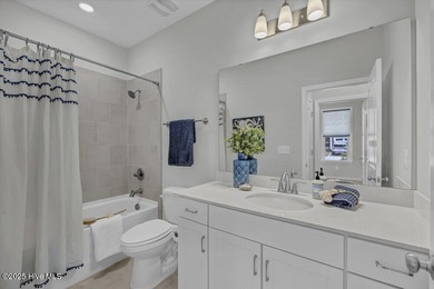 Discover the charm of low-maintenance living in this beautifully on Cape Fear National At Brunswick Forest in North Carolina - for sale on GolfHomes.com, golf home, golf lot