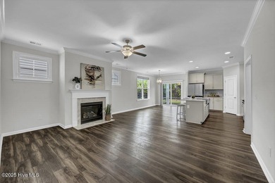 Discover the charm of low-maintenance living in this beautifully on Cape Fear National At Brunswick Forest in North Carolina - for sale on GolfHomes.com, golf home, golf lot