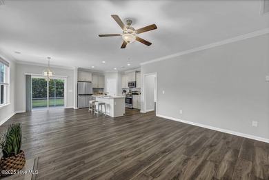 Discover the charm of low-maintenance living in this beautifully on Cape Fear National At Brunswick Forest in North Carolina - for sale on GolfHomes.com, golf home, golf lot