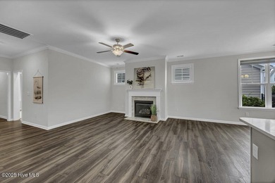 Discover the charm of low-maintenance living in this beautifully on Cape Fear National At Brunswick Forest in North Carolina - for sale on GolfHomes.com, golf home, golf lot