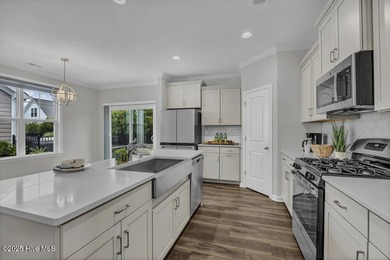 Discover the charm of low-maintenance living in this beautifully on Cape Fear National At Brunswick Forest in North Carolina - for sale on GolfHomes.com, golf home, golf lot