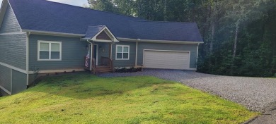 Welcome to this charming one-level home, perfectly situated to on Mountain Harbour Golf Club in North Carolina - for sale on GolfHomes.com, golf home, golf lot
