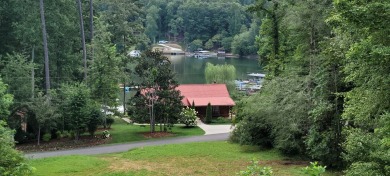 Welcome to this charming one-level home, perfectly situated to on Mountain Harbour Golf Club in North Carolina - for sale on GolfHomes.com, golf home, golf lot