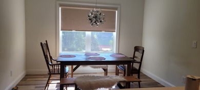 Welcome to this charming one-level home, perfectly situated to on Mountain Harbour Golf Club in North Carolina - for sale on GolfHomes.com, golf home, golf lot
