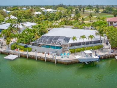 Marathon's Mermaid Manor is a waterfront home that truly lives on Sombrero Golf and Country Club in Florida - for sale on GolfHomes.com, golf home, golf lot