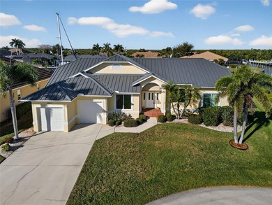 BEST BOAT CANAL VIEWS IN PUNTA GORDA ISLES! FULLY FURNISHED on Saint Andrews South Golf Club in Florida - for sale on GolfHomes.com, golf home, golf lot