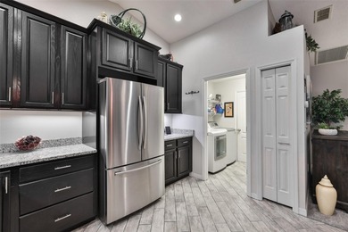 Wake up every day feeling like you're on vacation in this on Tampa Bay Golf and Country Club in Florida - for sale on GolfHomes.com, golf home, golf lot