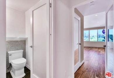 Elegant High-Rise Living at The Comstock, Set high on the 7th on Los Angeles Country Club in California - for sale on GolfHomes.com, golf home, golf lot