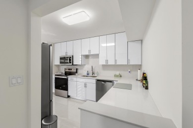 This completely remodeled first-floor residence in the Promenade on Boca Pointe Country Club in Florida - for sale on GolfHomes.com, golf home, golf lot