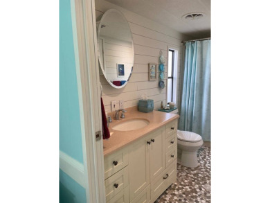 TIRED OF SNOW,ICE AND COLD, TRADE IT IN FOR SUN,WARM AND WHITE on Lake Fairways Country Club in Florida - for sale on GolfHomes.com, golf home, golf lot