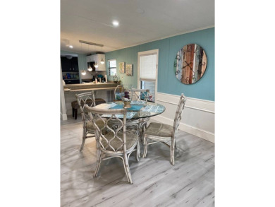 TIRED OF SNOW,ICE AND COLD, TRADE IT IN FOR SUN,WARM AND WHITE on Lake Fairways Country Club in Florida - for sale on GolfHomes.com, golf home, golf lot