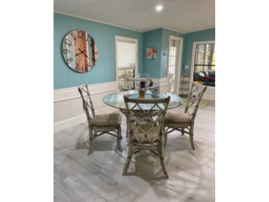 TIRED OF SNOW,ICE AND COLD, TRADE IT IN FOR SUN,WARM AND WHITE on Lake Fairways Country Club in Florida - for sale on GolfHomes.com, golf home, golf lot
