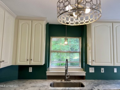 Welcome to your next chapter near Hickory Hill Golf Country Club on Mississippi National Golf Course in Mississippi - for sale on GolfHomes.com, golf home, golf lot
