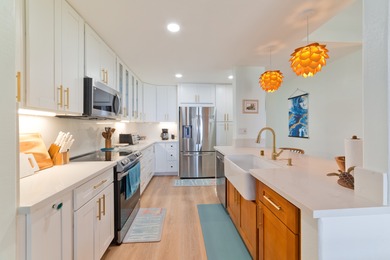 This stunning, upscale, totally renovated oceanfront view condo on Kona Country Club Golf Course in Hawaii - for sale on GolfHomes.com, golf home, golf lot