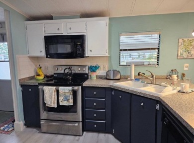 TIRED OF SNOW,ICE AND COLD, TRADE IT IN FOR SUN,WARM AND WHITE on Lake Fairways Country Club in Florida - for sale on GolfHomes.com, golf home, golf lot